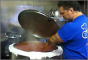Vince Faraci Stirring the Pizza Sauce
